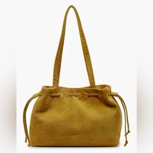 Suede drawstring mustard shoulder bag